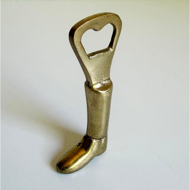 Vintage 1970s Ralph Lauren equestrian riding boot style bottle opener made of brass with a light, naturally aged patina....