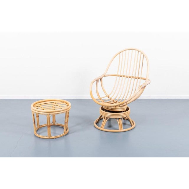 Bamboo lounge chair with pouf/side table. The seat has a sprig system which gives a swing felling by moving backwards and...