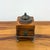 A charming limited edition keepsake box by Jo Marz, crafted from richly finished wood and elevated on ornate metal paw...