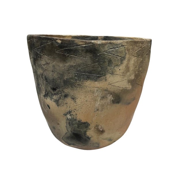 This Gafsa clay vessel hails from Tunisia, specifically the town of Gafsa known for its pottery craftsmanship. This...