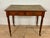 Elegant English Georgian style writing table crafted from solid wood with a warm oak-toned finish. The rectangular top...