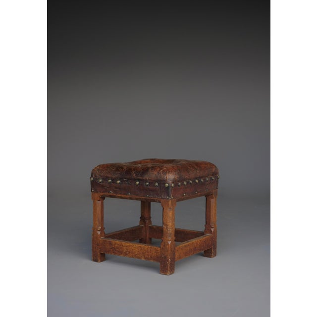 A small leather seated English oak stool with a very attractive patina. Designed by Gordon Russell for his own company...