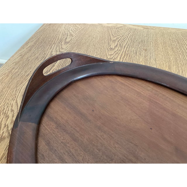 Elevate your entertaining or coffee table styling with this quintessential sculptural serving tray. Crafted from mahagony,...