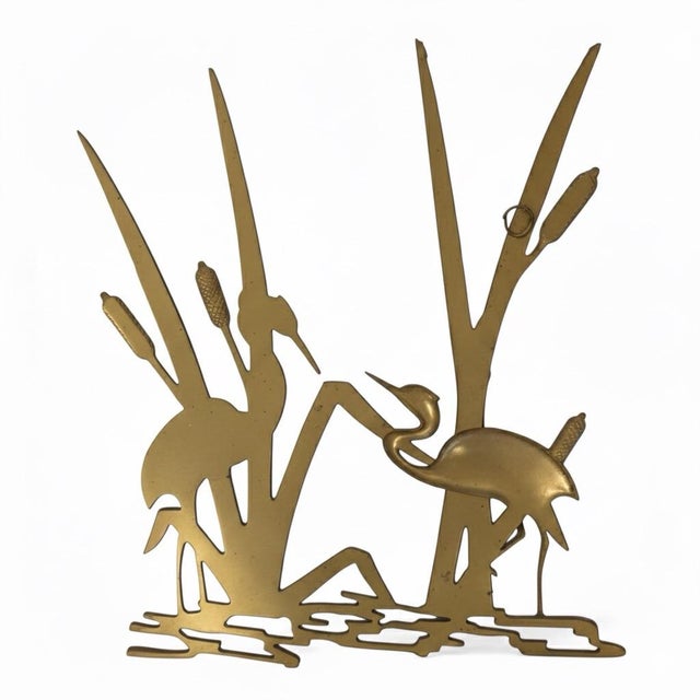 This exquisite vintage brass sculpture beautifully captures a serene wetlands scene, making it an ideal statement piece...