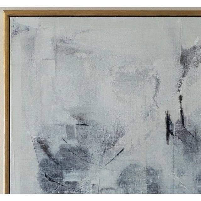 This is a large-scale, serene acrylic on canvas with layers of shades of gray framed in a mat finish antique gold colored...