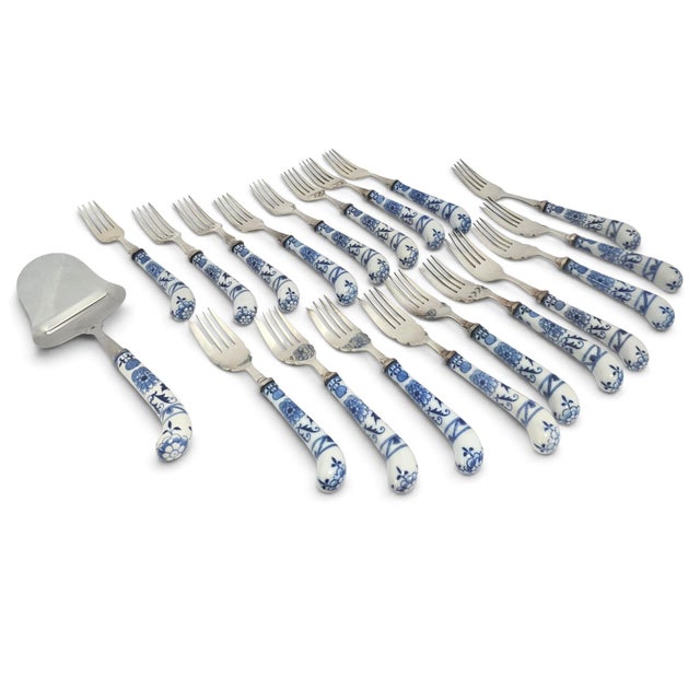 A coordinated mid-twentieth-century House of Prill Blue Onion flatware service with porcelain handles, combining...