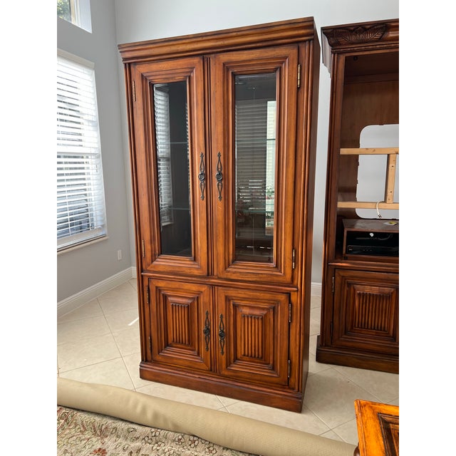 Vintage Tommy Bahama Style 3 piece Display & Entertainment center. Bottom has a Two Door Cabinet With Shelf. The Top half...