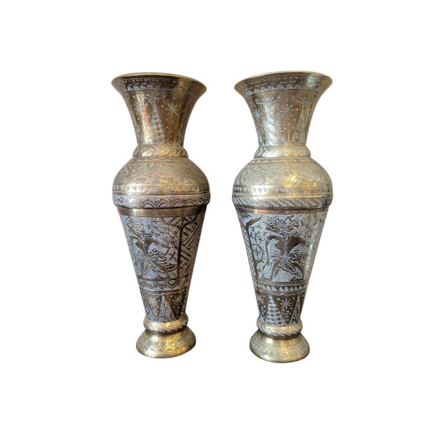 Fabulous mid-century (circa 40s) pair of Indian etched brass vases, featuring intricate detail and figural elements. Each...