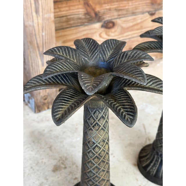 Vintage metal palm tree candle holders in a rustic bronze finish. Great for a coastal table or on a mantle. Please zoom in...