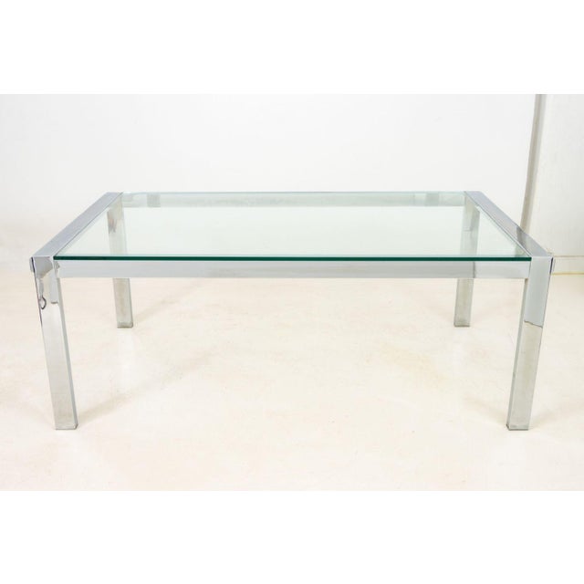 Modern Glass Top Chrome Plated Metal Dining Table, rectangular on four block legs. 29" H x 75" W x 42" D. Provenance: From...