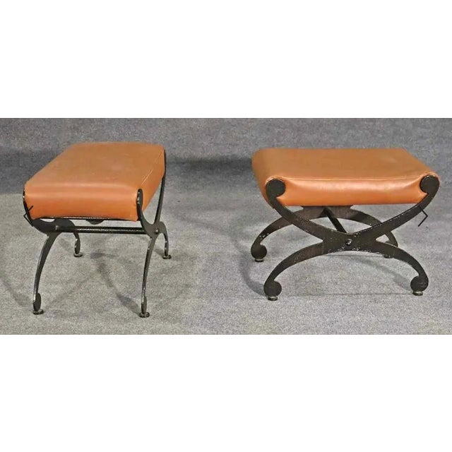 Vintage style ottomans with leather seats and wrought iron frames. Please confirm location. SKU: SS101-102227