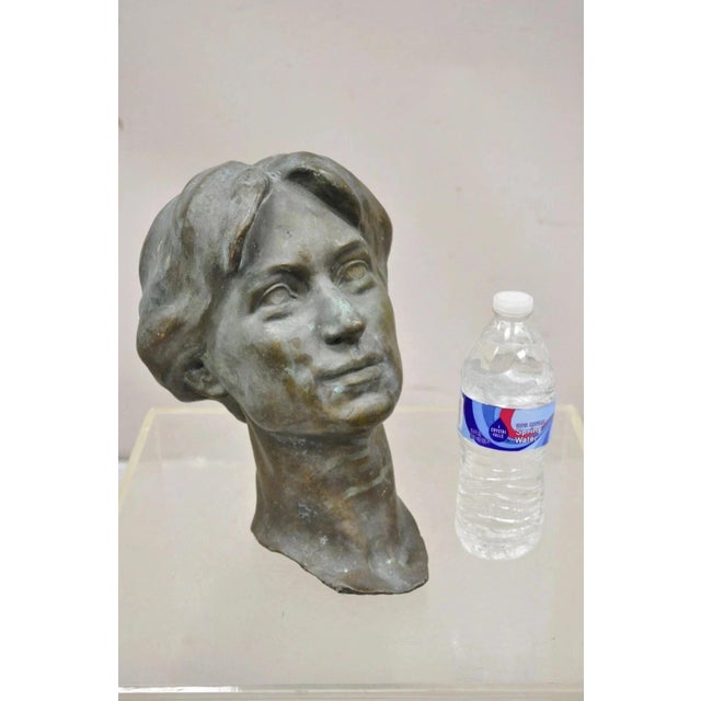 Vintage Patinated Cast Bronze Bust Statue Sculpture of Woman with Pinned Hair. Item featured has wonderful desired patina,...