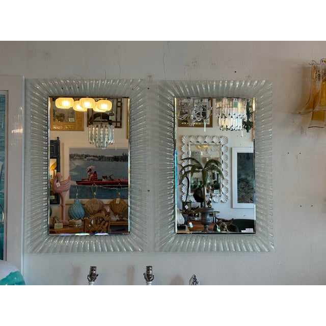 Lovely pair of vintage Murano glass mirrors. No chips or breaks to the glass. The entire mirror, including the back, is...