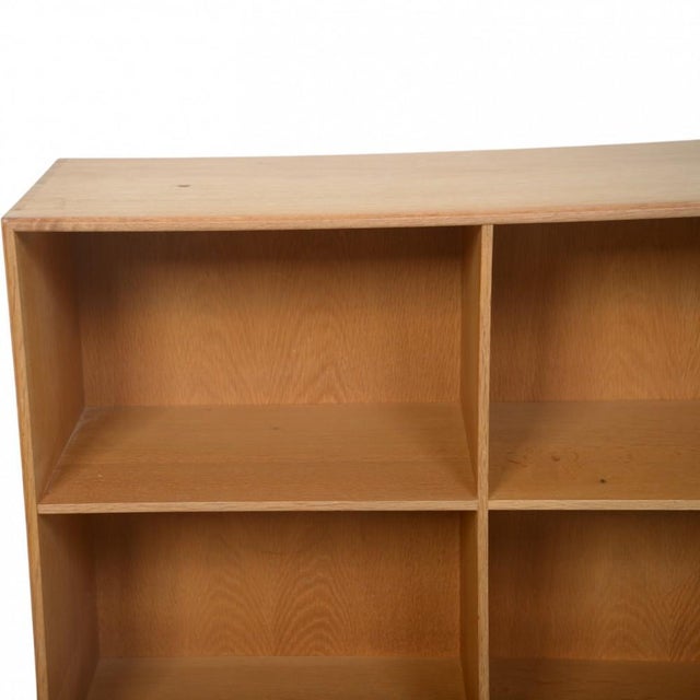 Mogens Koch bookcase made of oak. The bookcase is from the 1980s and appears with some marks and scratches. •Designer:...