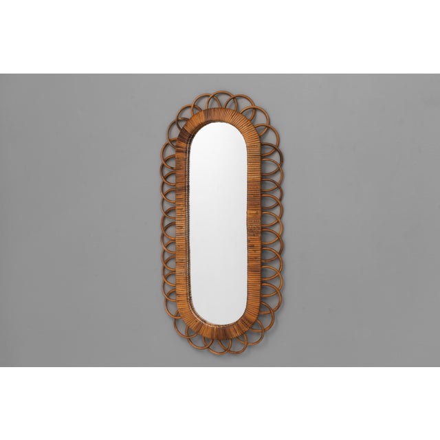 A 1980s bamboo oval mirror with plywood back after Franco Albini design. France circa 1980.