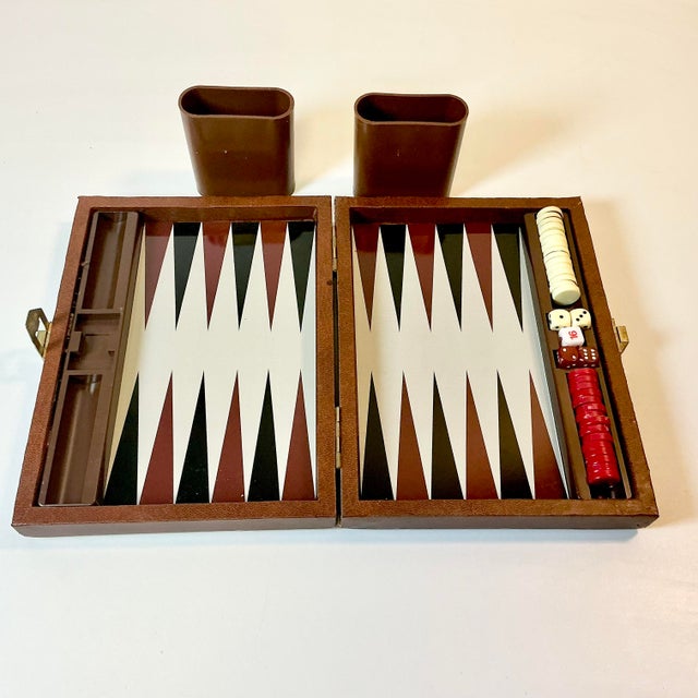We love this Travel Backgammon Set. It features a magnetic board and each piece has a magnet. The game can be played in a...