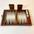We love this Travel Backgammon Set. It features a magnetic board and each piece has a magnet. The game can be played in a...