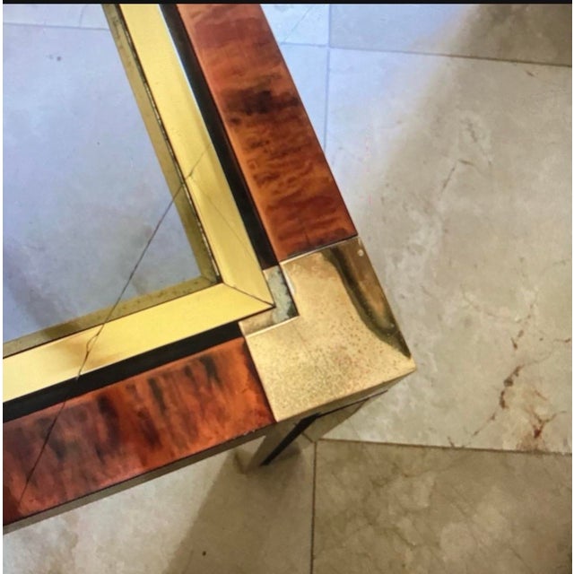 80s modern brass and faux tortoise square coffee table! Smoky glass inset trimmed in brass. Legs have a combo of brass and...