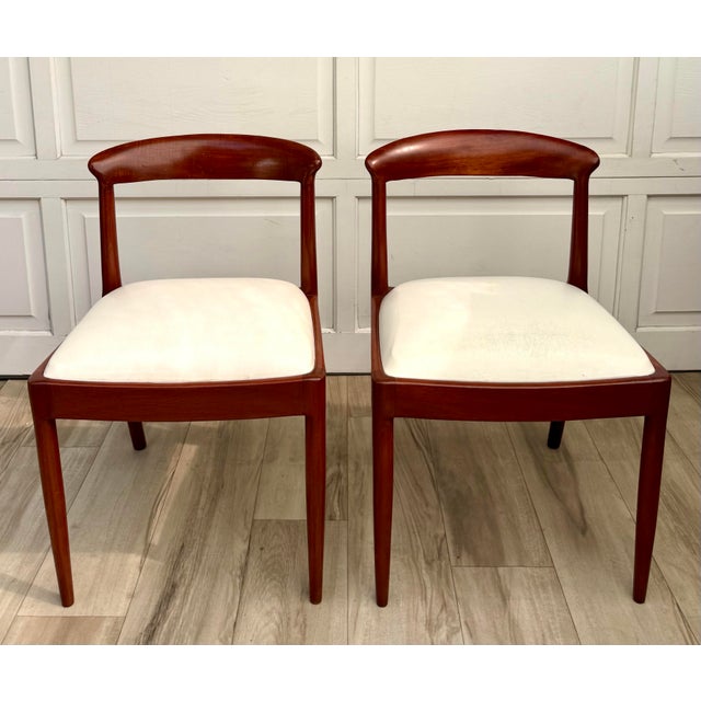 Dating to the 1960s, this fabulous pair of Mid-Century Modern dining chairs is distinguished by beautifully sculptural...
