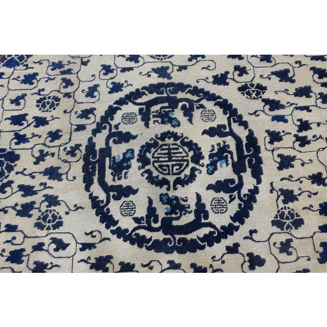 Antique 1860s Chinese Peking Rug Size: 11'0" x 11'3" (335 x 342 cm) This exquisite antique Chinese rug, dating from the...
