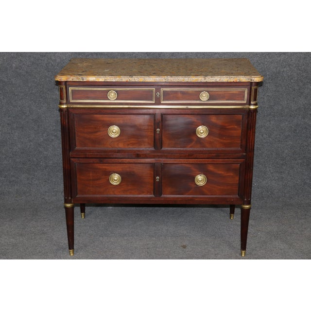 This is a delicately design, beautifully crafted commode by Maison Carlihan of Paris. The piece is surmounted by a...