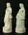 a nice pair of large bisque figurines White Parian porcelain depicting a man and a woman in Rococo-style attire Both are...