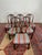 Elevate your dining experience with this exquisite set of six antique dining chairs. Each chair features beautifully...