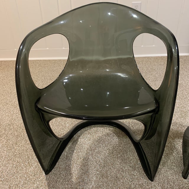 These chairs are extremely comfortable, as well as great conversation pieces. They are in a Smokey gray/black clear...