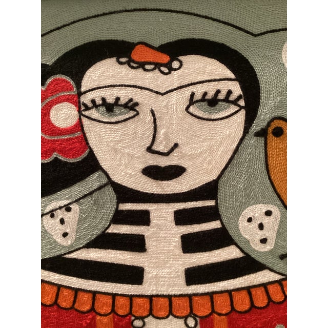 This is a fiber art wall hanging done in a chain stitch pattern. It depicts Frida Kahlo themed in the Picasso inspired...