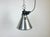 Small Industrial factory pendant light made in France during the 1960s. It features a silver aluminium shade and a black...