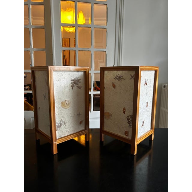 Pair of 1970s lamps with a wooden and paper structure, incorporating dried flowers. European Plug (up to 250V).The wiring...