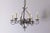 This is a pair of 20th-century French wrought iron chandeliers, showcasing elegant craftsmanship with their intricate...