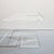 Modern, minimalist acrylic glass side table. Its clean-lined, fully transparent design creates a "floating" effect,...