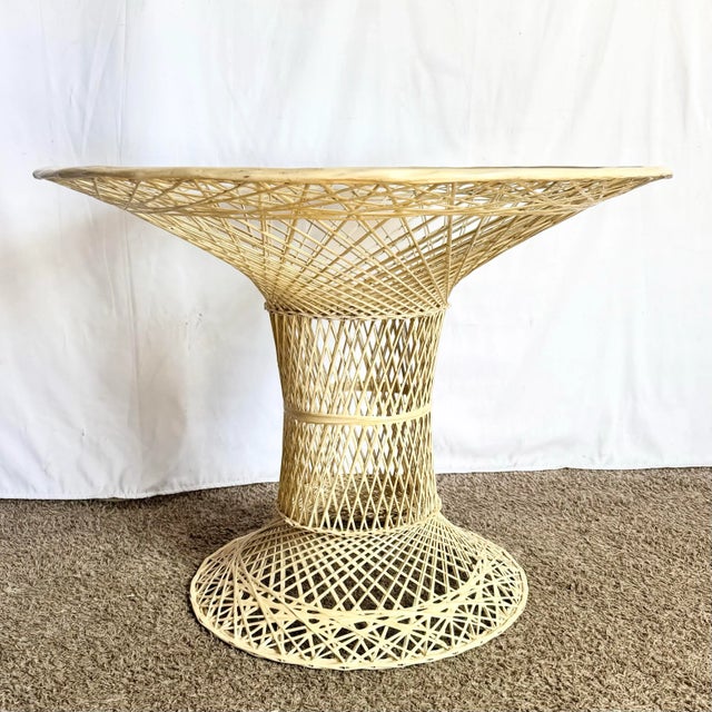This mid-century modern spun fiberglass dining table showcases an airy, sculptural design reminiscent of Salterini and...