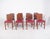 Set of eight Deco-style dining chairs. Sober lines and a sturdy wooden frame, they have a functional, modern-inspired...