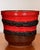A substantial vintage West German Bay Keramik ceramic planter featuring vivid red glaze, deeply textured black lava-glaze...