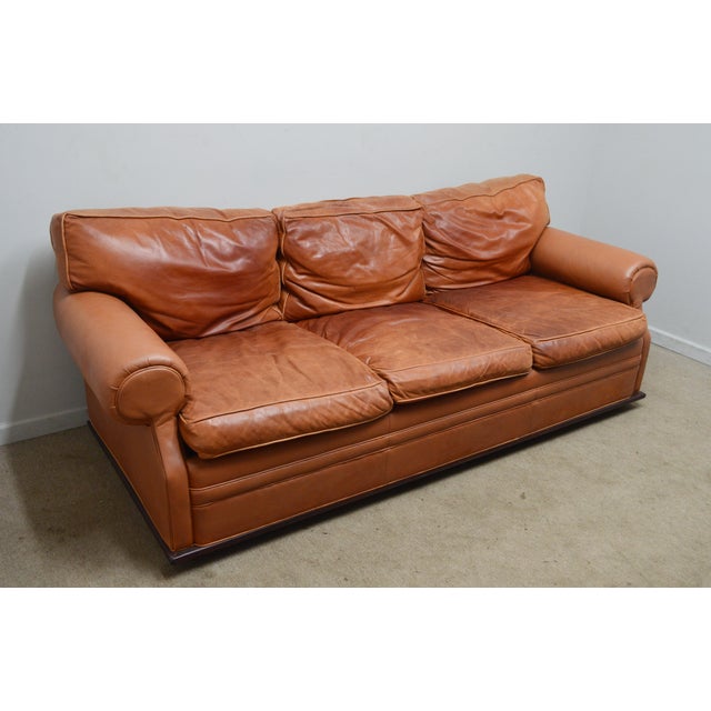 Standard Sofa by Ralph Lauren. Store item #532. It features leather upholstery and wooden base.