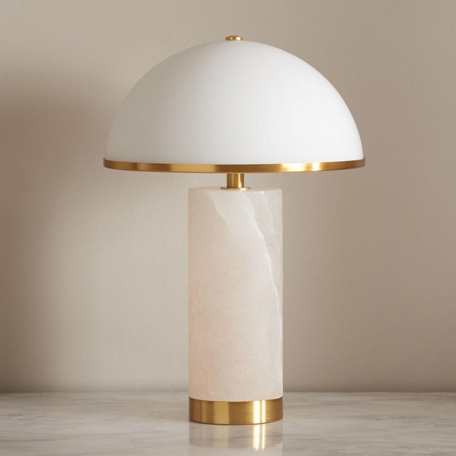 Bring chic style and glamour to your tabletop with our Izabel table lamp. Elevated with rich materials and retro glam, our...