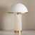 Bring chic style and glamour to your tabletop with our Izabel table lamp. Elevated with rich materials and retro glam, our...