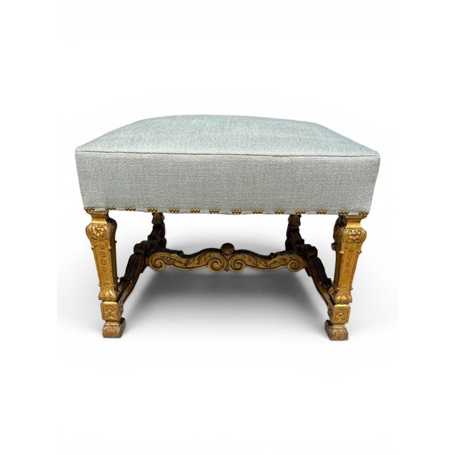 A handsome pair of late 19th century Italian carved giltwood ottomans, circa 1880–1900. Each features a newly upholstered...