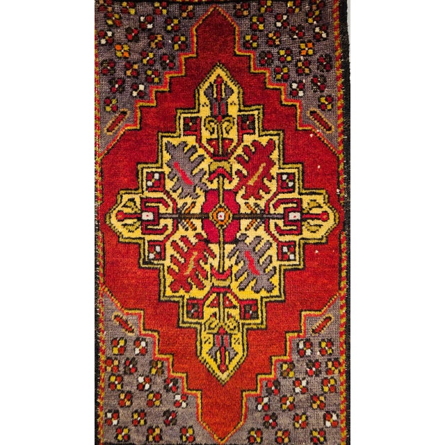 This beautiful mid-20th century Anatolian village rug showcases a classic prayer design brought to vivid, saturated life...