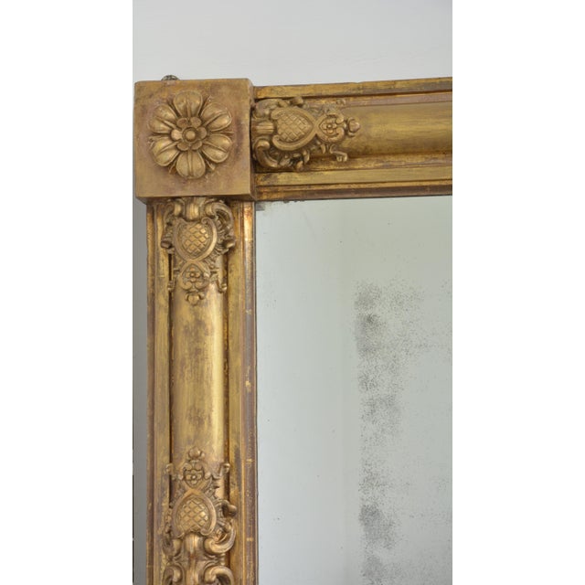 K0661 fine quality and very attractive regency giltwood overmantel mirror, having original foxed glass in gilded frame...