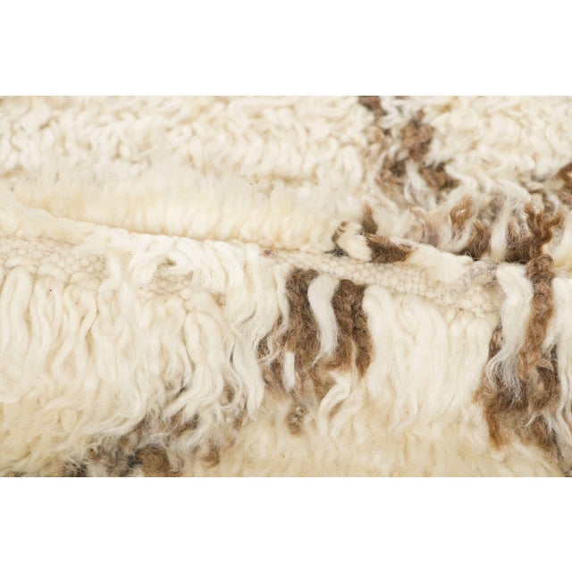 Hand-knotted in wool and originating circa 1950-1959, this 5x9 vintage shag rug joins Rug & Kilim’s Moroccan collection....