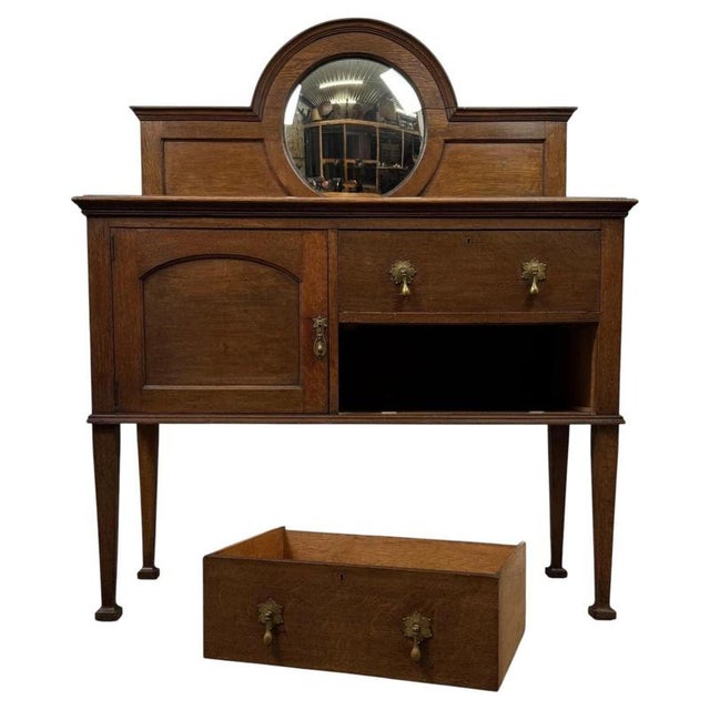 A superb early 20th-century English Edwardian sideboard, finely constructed in oak and distinguished by an impressive...