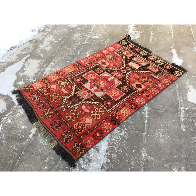 This is a vintage ram horn design rug, used to represent power. The piece was vegetable dyed and made in the 1960s. This...