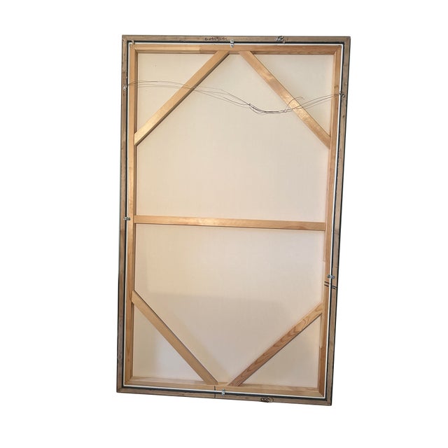 Striking contemporary abstract painting featuring sweeping strokes of blue, black, tan, and white, set within a sleek...