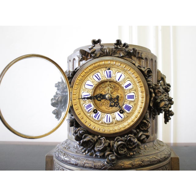 Late 19th Century Gilt Bronze French Mantle Clock with Rose Swags. Decorated with a large ribbon bow and clusters of roses...