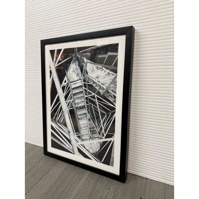Design Plus Gallery presents a Framed Black + White Architectural Print. The composition captures an intricate network of...
