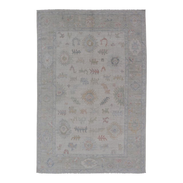 Large Oushak Rug With Floral Motifs & Muted Colorful Tones on Neutral Background For Sale