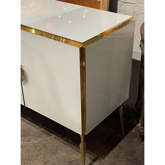 Very fine modern Murano glass sideboard. This piece has beautiful glistening white glass along with polished brass....